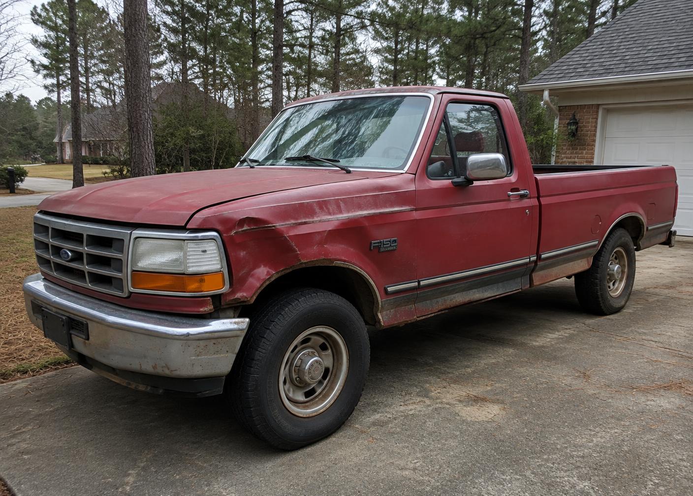 Older pickup truck awaiting collection